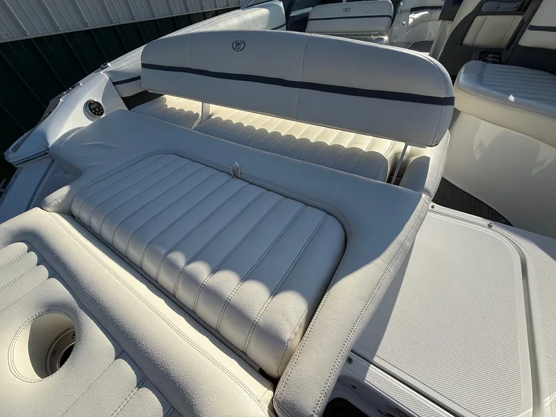 Slide: The Image of Interior of a 2015 Cobalt R7 boat with white leather seating. - 31