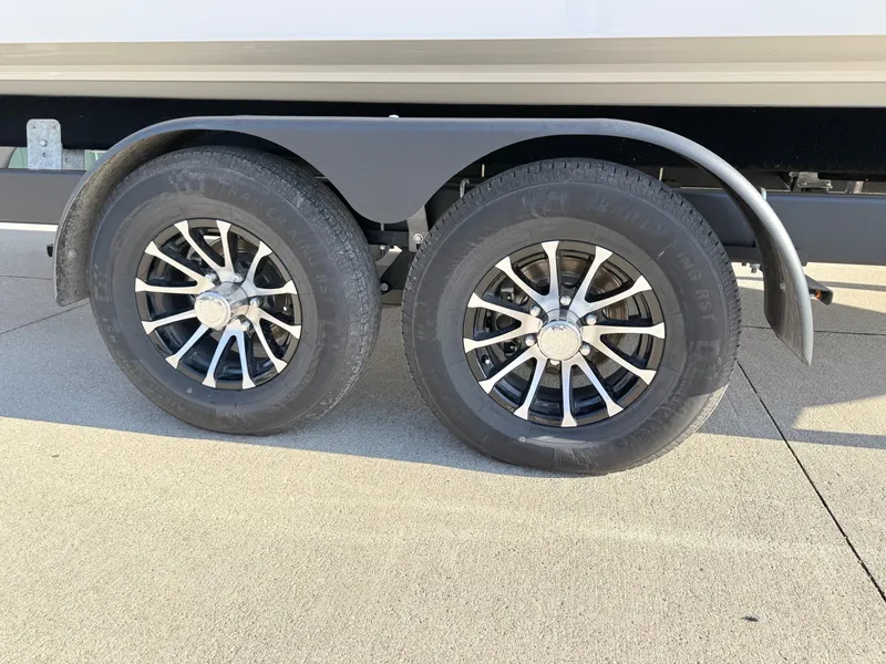 Slide: The Image of Dual wheels of a 2015 Cobalt R7 boat trailer on concrete. - 45