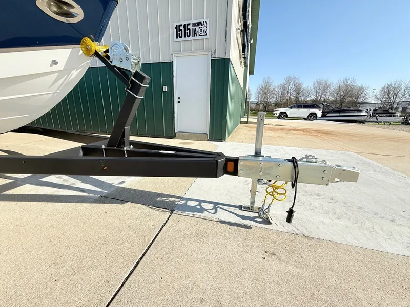 Slide: The Image of Cobalt R7 boat trailer in front of a building, 2015 model. - 46