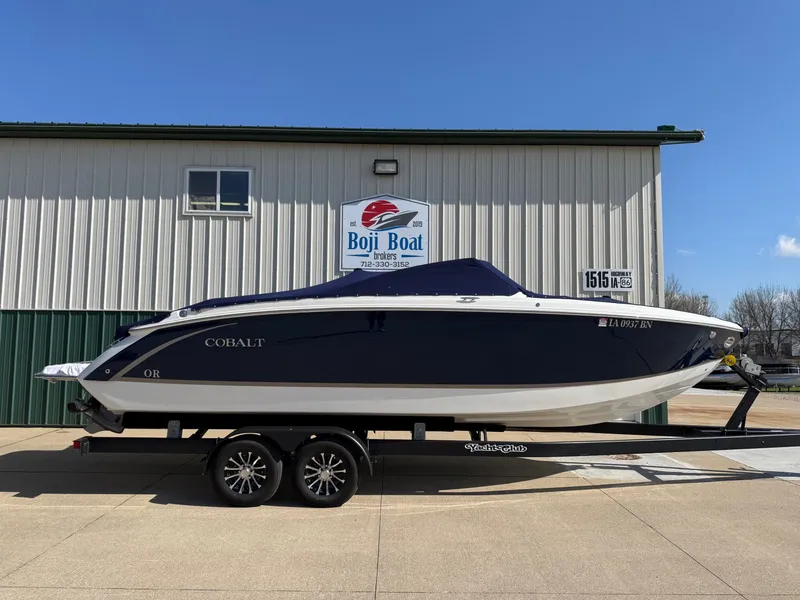 Slide: The Image of 2015 Cobalt R7 boat on trailer in front of Boji Boat building. - 47