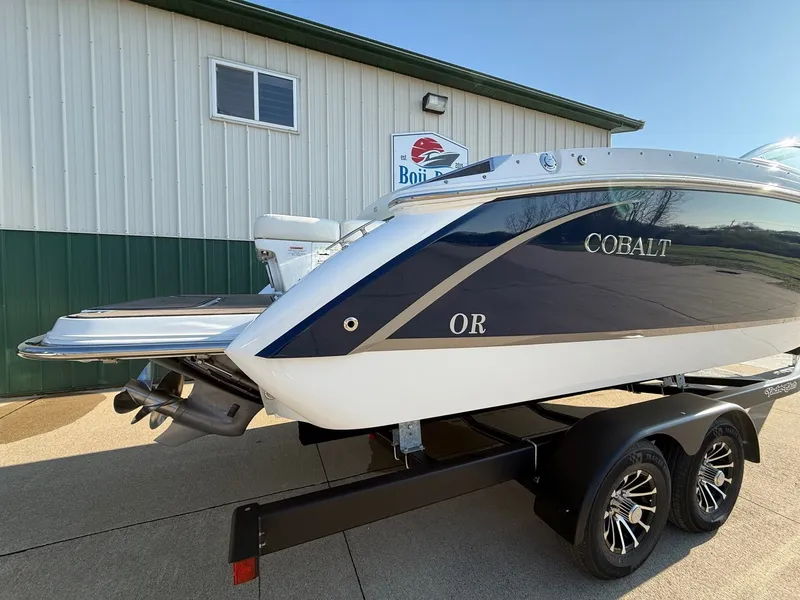Slide: The Image of 2015 Cobalt R7 boat on trailer in front of building. - 7