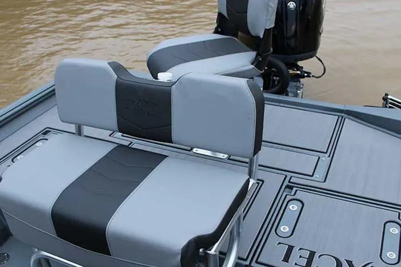 Slide: The Image of 2026 Excel 220 Bay Pro Elite boat seats with sleek gray and black design on water. - 9