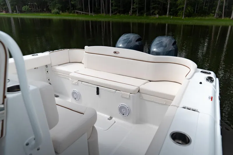 Slide: The Image of 2021 Sea Hunt Ultra 275 SE boat with spacious deck and seating. - 11
