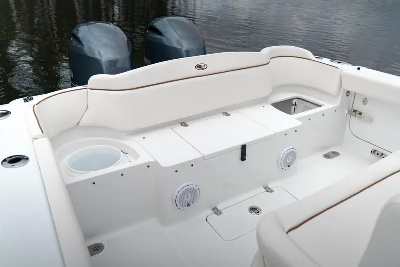 Slide: The Image of 2021 Sea Hunt Ultra 275 SE boat interior with toilet and storage compartments. - 15