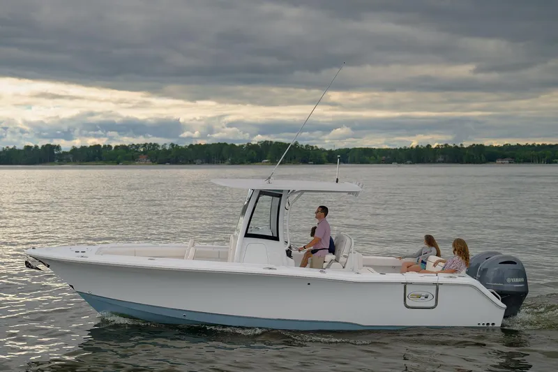 Slide: The Image of 2021 Sea Hunt Ultra 275 SE boat interior with covered console and American flag. - 6