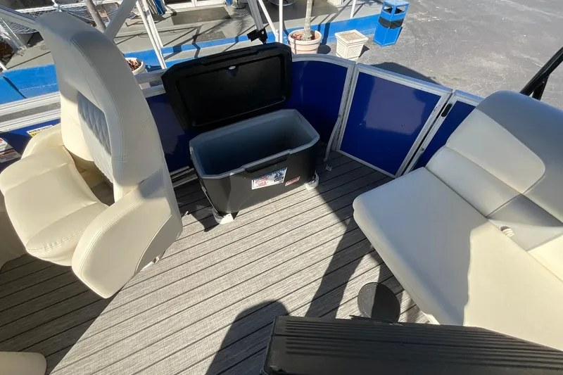 Slide: The Image of Interior of a 2021 Lexington 318 3 Series boat with seating and storage. - 12