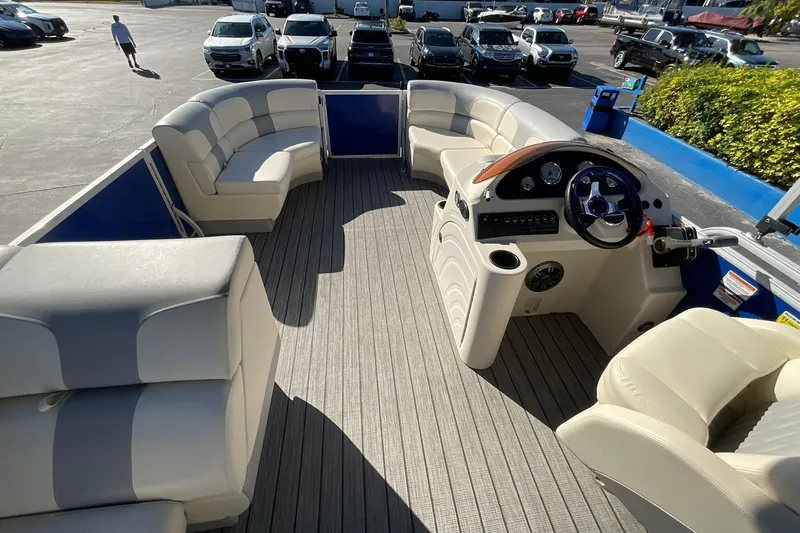 Slide: The Image of Luxurious interior of 2021 Lexington 318 3 Series pontoon boat with plush seating and modern helm. - 14