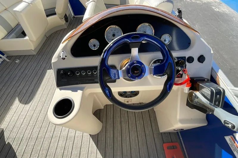 Slide: The Image of Steering console of a 2021 Lexington 318 3 Series boat with gauges and controls. - 20