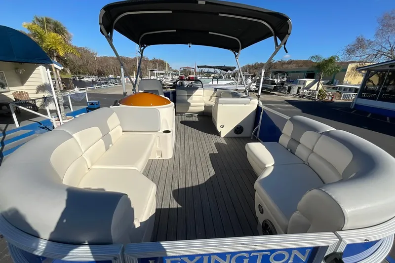 Slide: The Image of Luxurious 2021 Lexington 318 3 Series pontoon boat with spacious seating and canopy. - 8