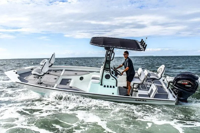 The Image of 2026 Excel 230 Bay Pro Elite boat cruising on open water with a Yamaha engine. - 0