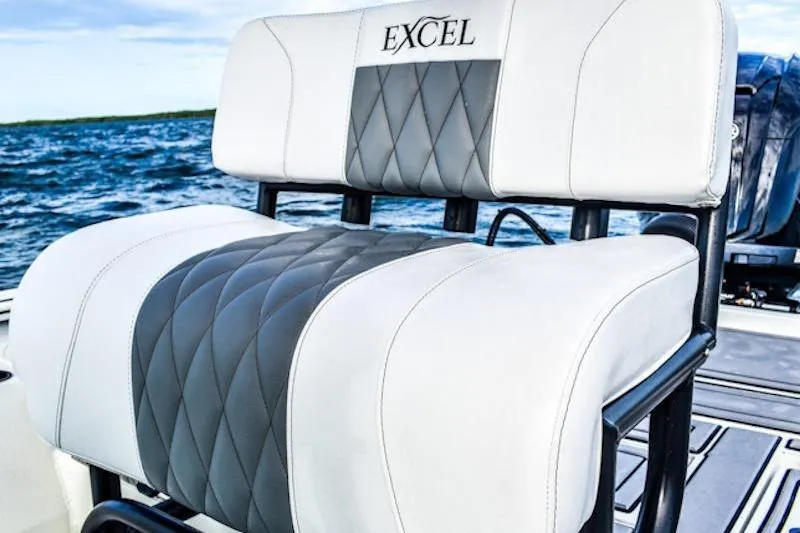 Slide: The Image of 2026 Excel 230 Bay Pro Elite boat seat with quilted design on open water. - 4