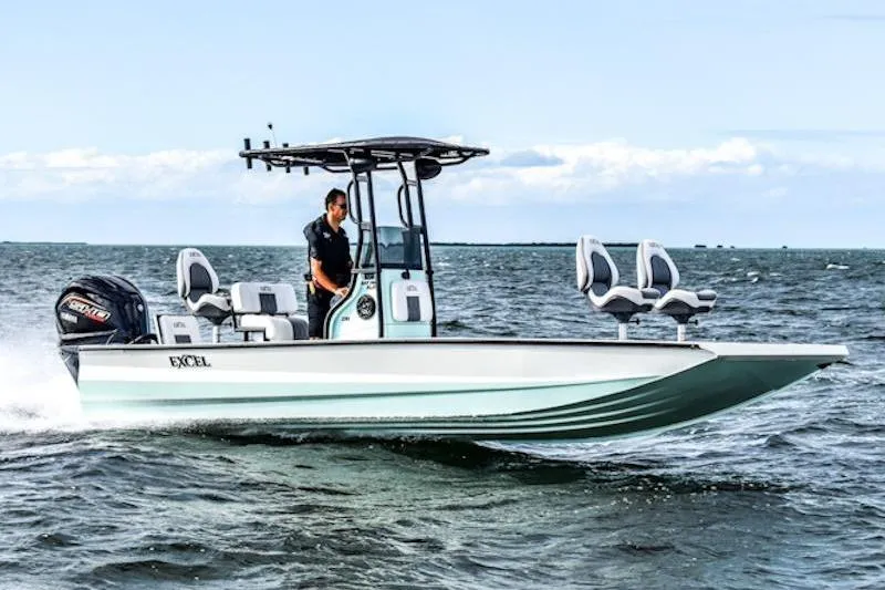 Slide: The Image of 2026 Excel 230 Bay Pro Elite boat cruising on open water. - 5