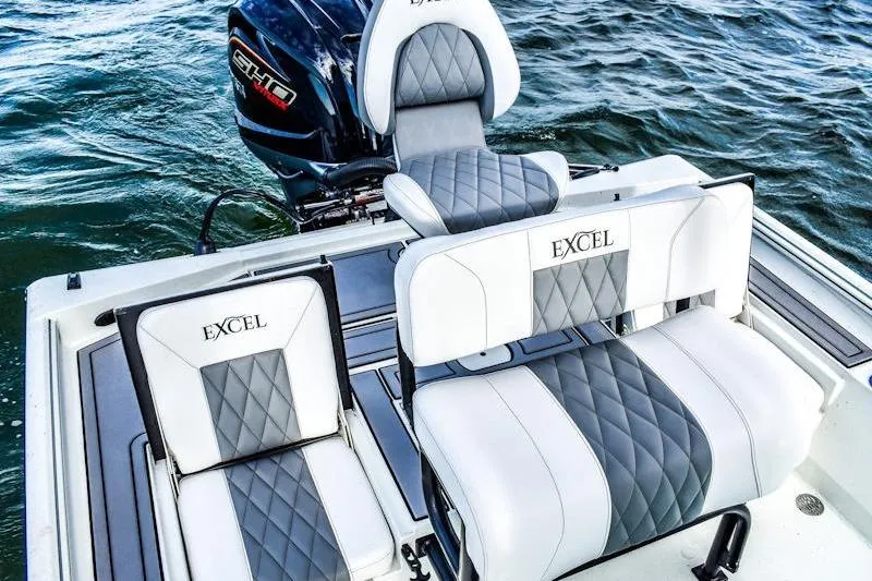Slide: The Image of 2026 Excel 230 Bay Pro Elite boat seats with diamond stitching on water. - 6