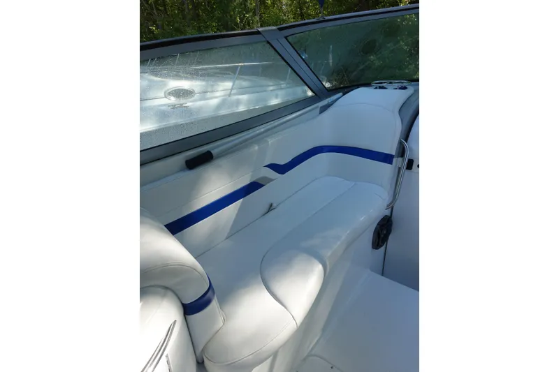 Slide: The Image of Interior seating of a 2002 Formula 330 Sun Sport boat with blue accents. - 10