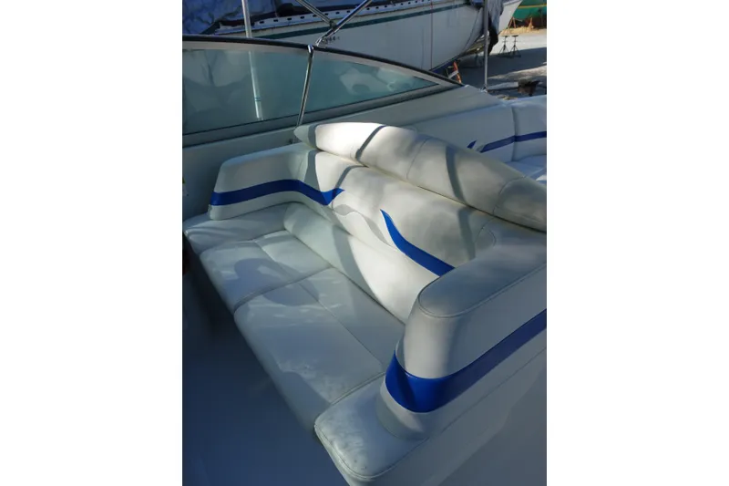 Slide: The Image of 2002 Formula 330 Sun Sport boat interior with white and blue seating. - 11