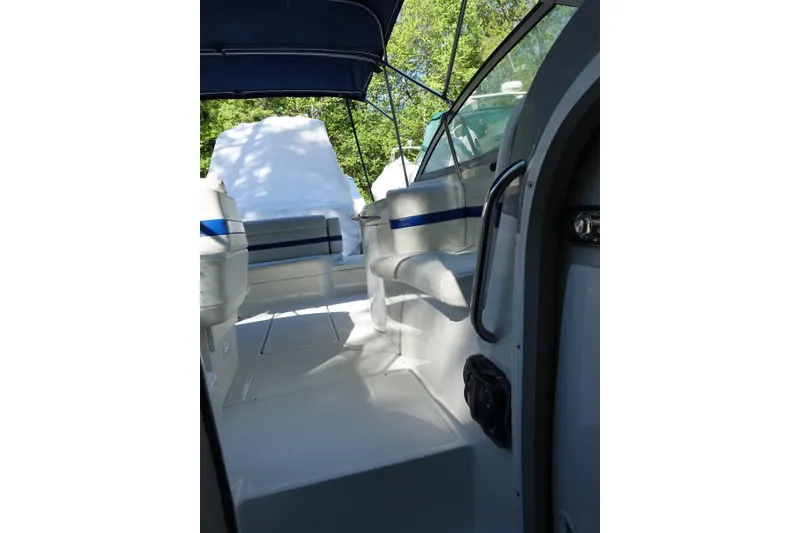 Slide: The Image of 2002 Formula 330 Sun Sport boat interior with seating and canopy, showcasing sleek design. - 13