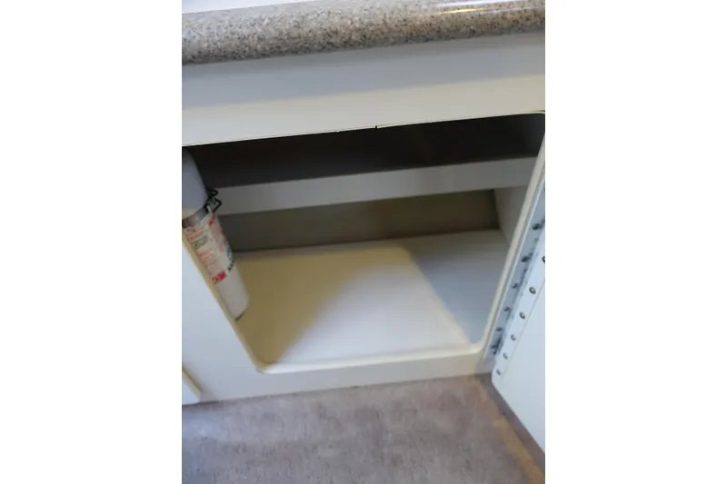 Slide: The Image of Open storage compartment in 2002 Formula 330 Sun Sport boat interior. - 14