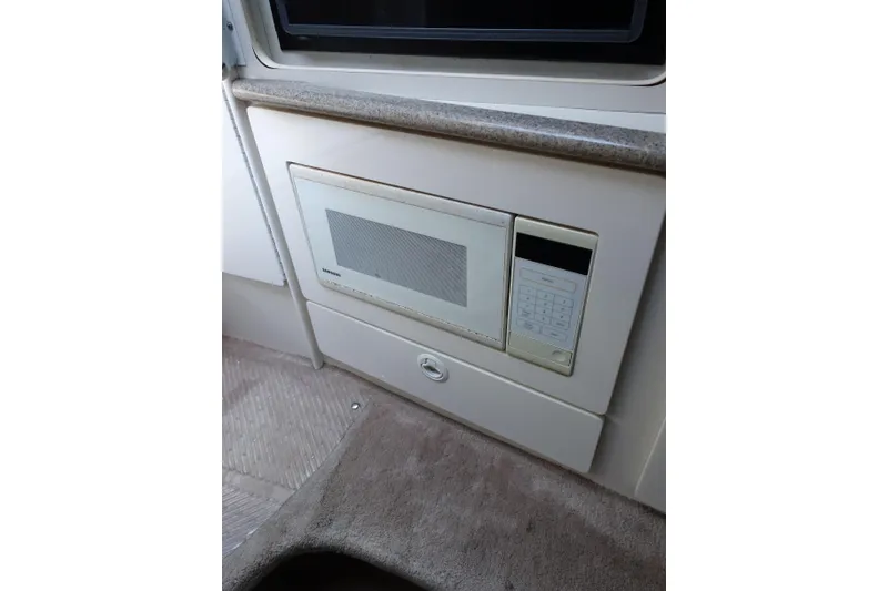 Slide: The Image of Built-in microwave in 2002 Formula 330 Sun Sport boat interior. - 18