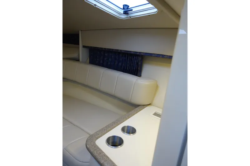 Slide: The Image of Interior of 2002 Formula 330 Sun Sport boat with cushioned seating and cup holders. - 20