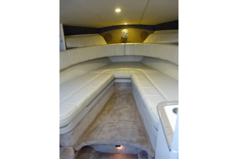Slide: The Image of Interior cabin of a 2002 Formula 330 Sun Sport boat with beige seating. - 23