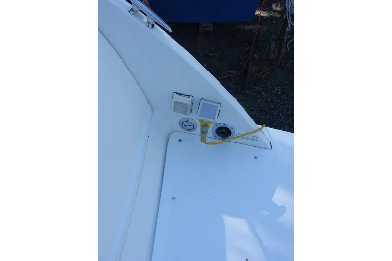 Slide: The Image of 2002 Formula 330 Sun Sport boat deck with electrical outlet and cable connection. - 24