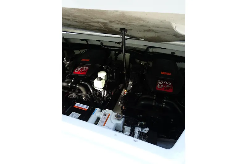 Slide: The Image of Engine compartment of a 2002 Formula 330 Sun Sport boat, featuring dual 6.2 MPI engines. - 26