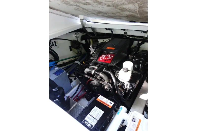 Slide: The Image of Engine compartment of a 2002 Formula 330 Sun Sport boat, featuring a MerCruiser 6.2 MPI engine. - 28