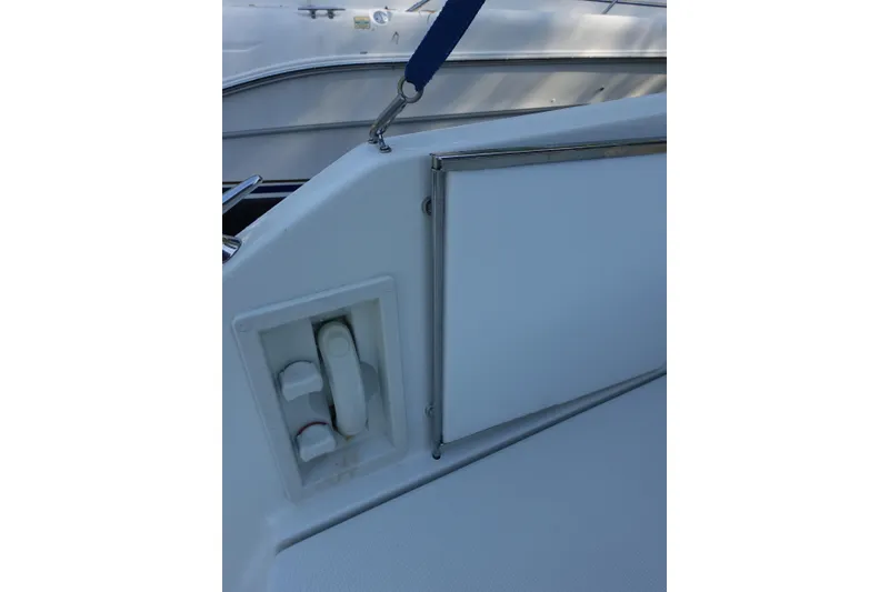 Slide: The Image of 2002 Formula 330 Sun Sport boat interior detail with control panel and seating. - 4