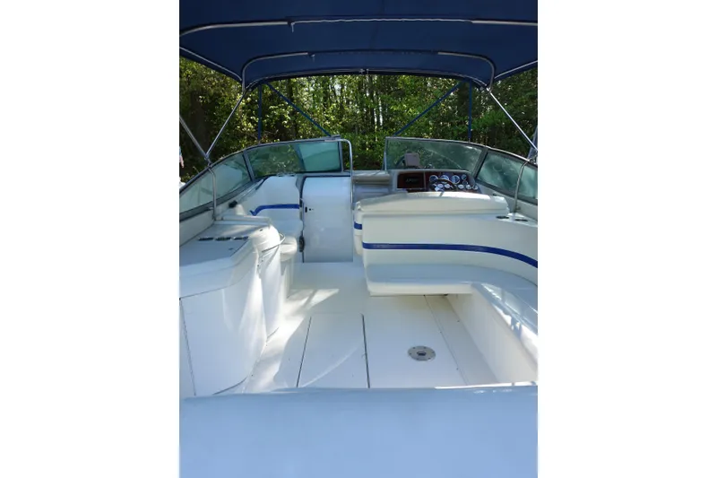 Slide: The Image of 2002 Formula 330 Sun Sport boat interior with blue accents and canopy. - 5