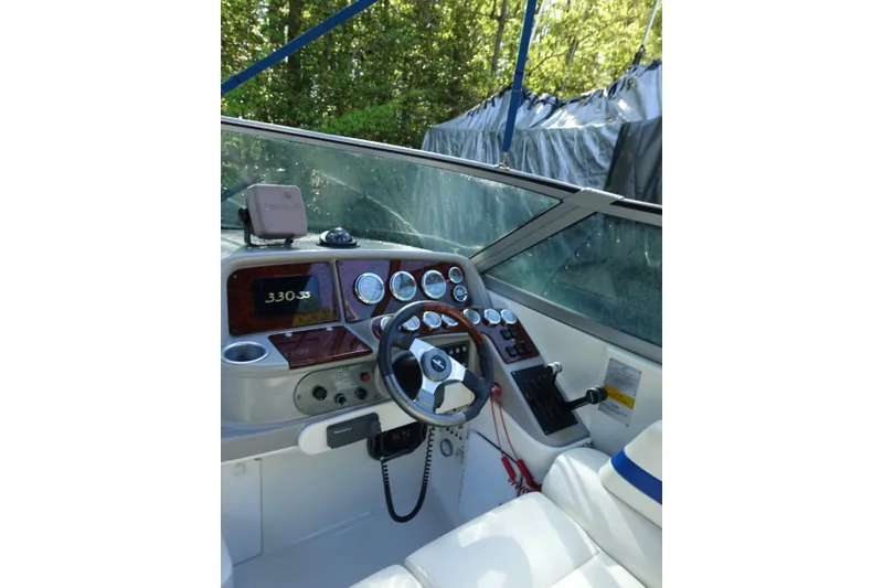 Slide: The Image of Cockpit of 2002 Formula 330 Sun Sport boat with steering wheel and control panel. - 6