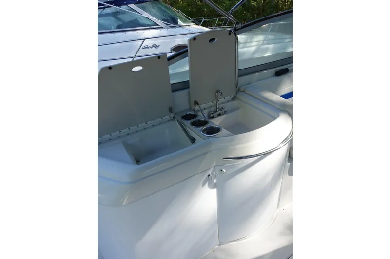 Slide: The Image of 2002 Formula 330 Sun Sport boat interior with sink and cup holders. - 9
