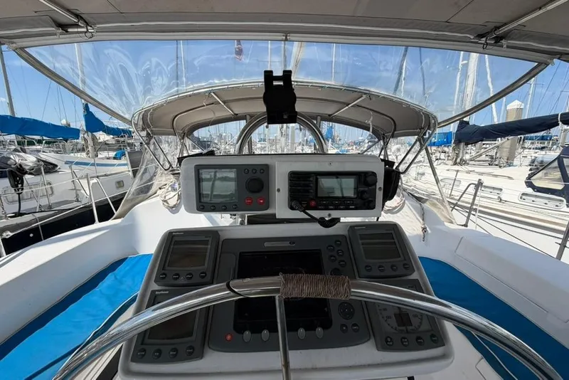 Slide: The Image of Cockpit view of a 2002 Hunter 410 sailboat with navigation instruments. - 21