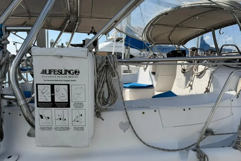 Slide: The Image of 2002 Hunter 410 sailboat cockpit with Lifesling2 rescue system and nautical equipment. - 22