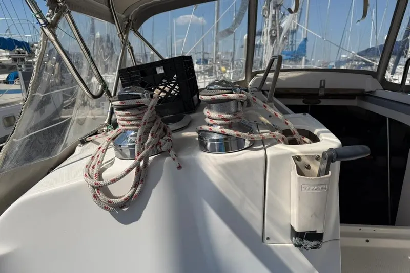 Slide: The Image of Deck of a 2002 Hunter 410 sailboat with ropes and winches. - 28