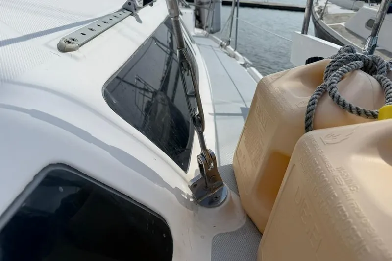 Slide: The Image of Close-up of a 2002 Hunter 410 sailboat deck with diesel containers. - 34