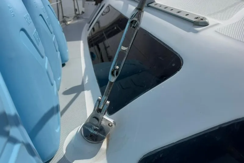 Slide: The Image of Close-up of a 2002 Hunter 410 sailboat deck with rigging and blue containers. - 36