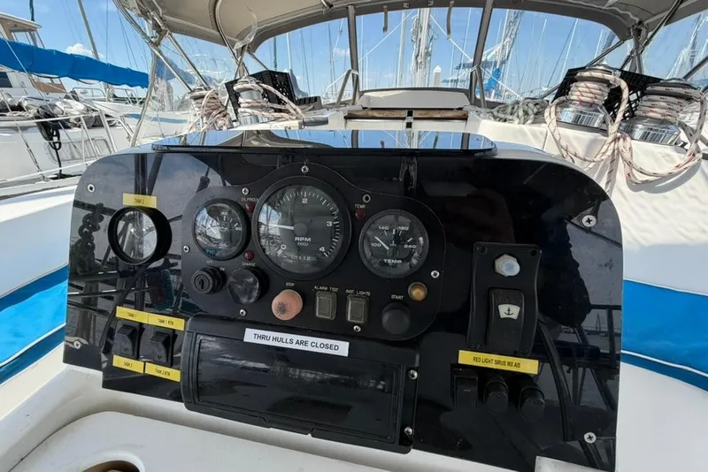 Slide: The Image of Control panel of a 2002 Hunter 410 sailboat with gauges and switches. - 37