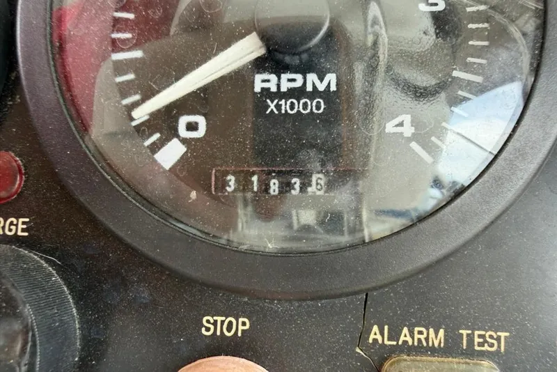 Slide: The Image of Close-up of a Hunter 410 tachometer showing 3183.6 RPM hours, model year 2002. - 39