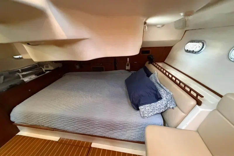 Slide: The Image of Cozy cabin interior of 2002 Hunter 410 sailboat with comfortable bedding. - 42