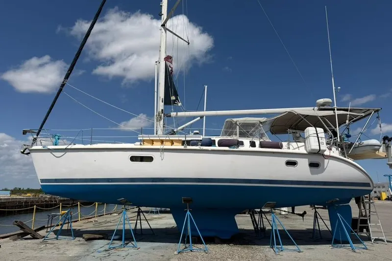 Slide: The Image of Sailboat Hunter 410, 2002 model, on dry dock under clear blue sky. - 8