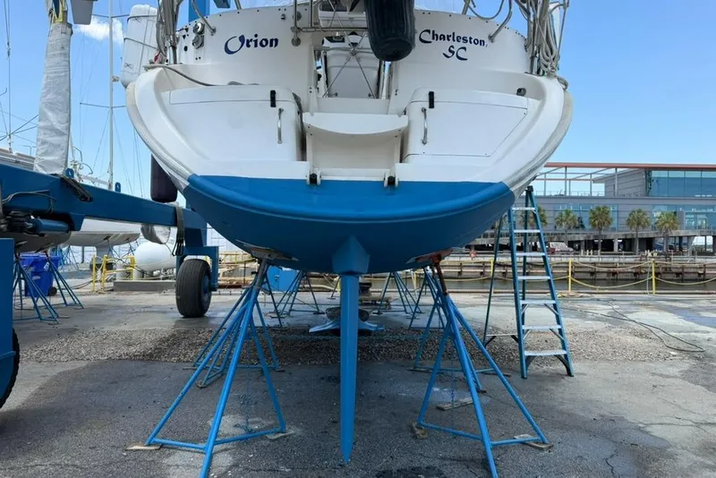 Slide: The Image of Hunter 410 sailboat from 2002 on stands, Charleston SC, marina background. - 9