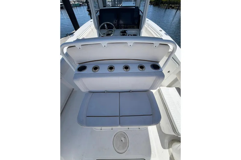 Slide: The Image of 2021 Sea Hunt Gamefish 27 Coffin Box boat interior with seating and cup holders. - 10