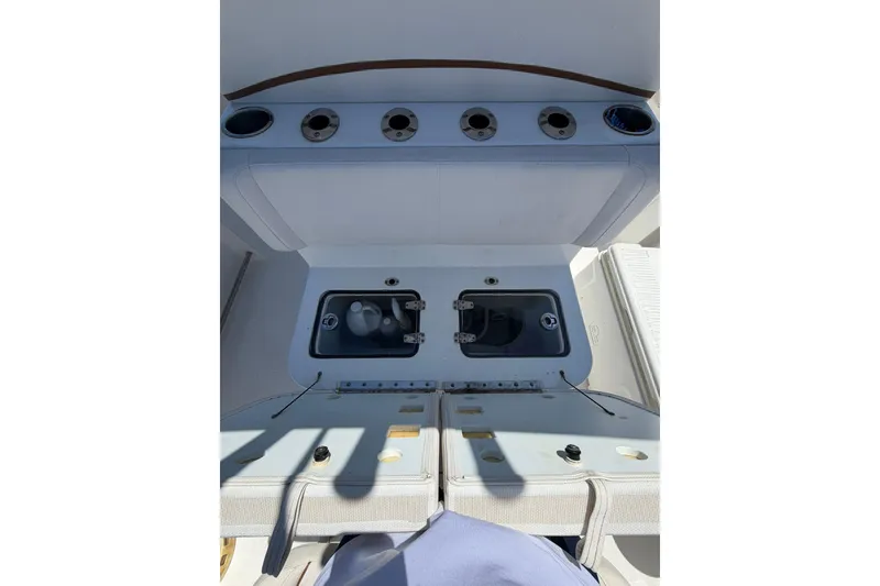 Slide: The Image of 2021 Sea Hunt Gamefish 27 Coffin Box boat interior with storage compartments. - 11