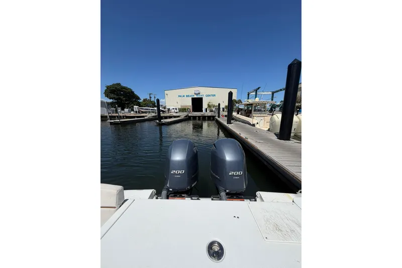 Slide: The Image of 2021 Sea Hunt Gamefish 27 Coffin Box at marina with dual 200 engines. - 5