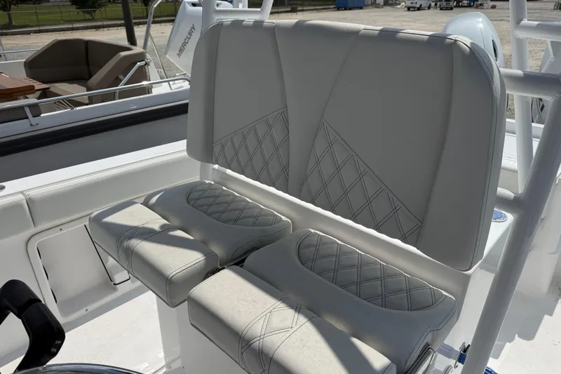 Slide: The Image of 2026 Clearwater 2800 Center Console boat seating with diamond-stitched upholstery. - 6