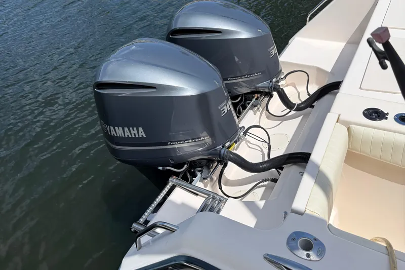 Slide: The Image of 2006 Grady-White Bimini 306 boat with dual Yamaha 300 outboard engines on water. - 12