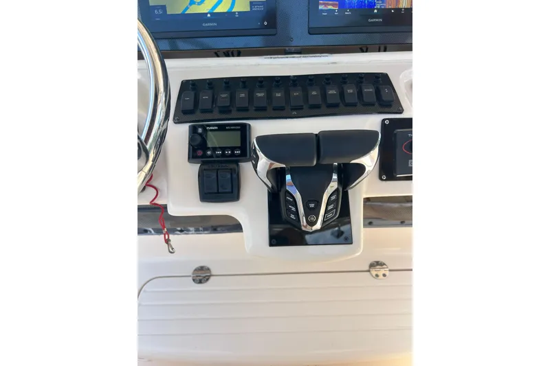 Slide: The Image of Control panel of a 2006 Grady-White Bimini 306 boat with navigation equipment. - 16