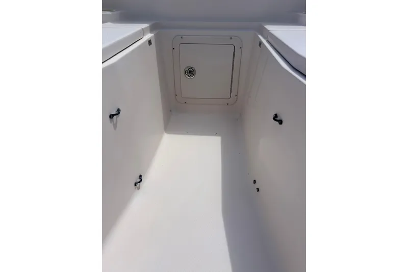 Slide: The Image of 2006 Grady-White Bimini 306 boat interior storage compartment, white finish. - 18