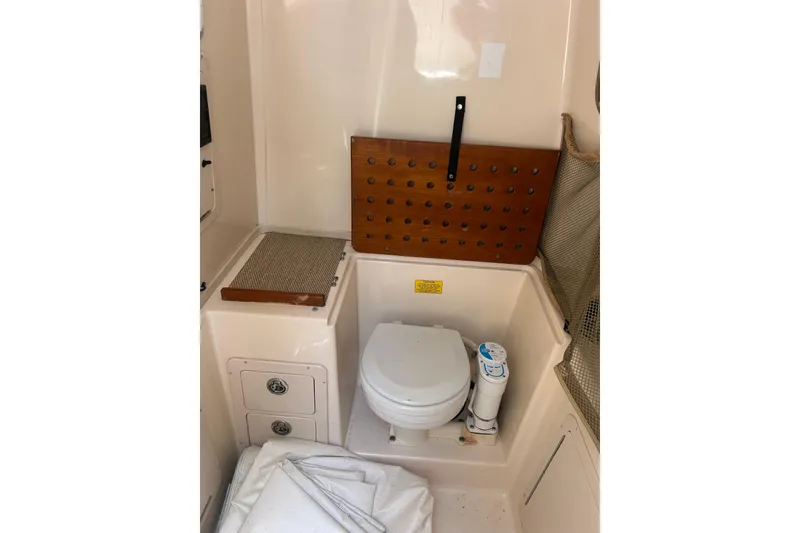 Slide: The Image of Interior of 2006 Grady-White Bimini 306 boat with compact marine toilet. - 20
