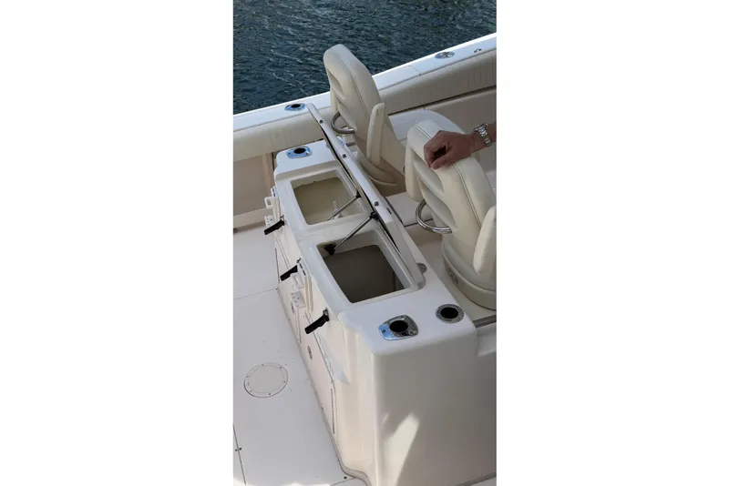 Slide: The Image of 2006 Grady-White Bimini 306 boat interior with seating and storage compartments. - 7